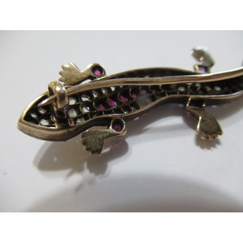 1001 - Unmarked yellow and white metal lizard brooch set rose cut diamonds and pink rubies, 5.5cm long, 6.5... 