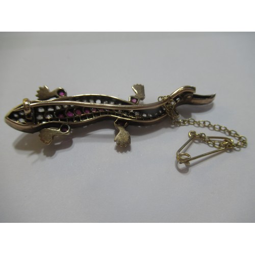 1001 - Unmarked yellow and white metal lizard brooch set rose cut diamonds and pink rubies, 5.5cm long, 6.5... 