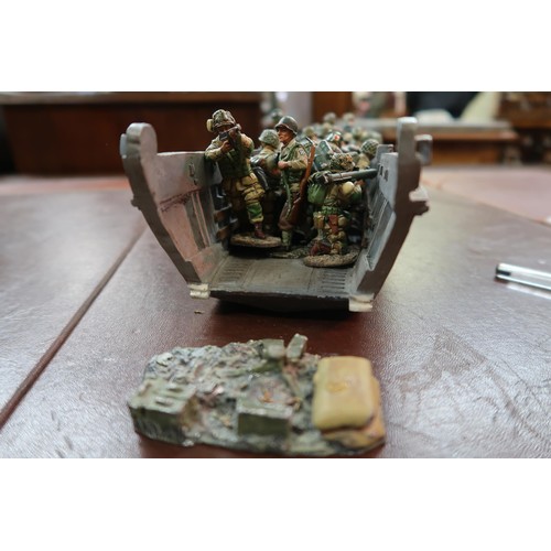 207 - Collection of ' Queen & Country ' toy soldiers and model vehicles in a wicker basket