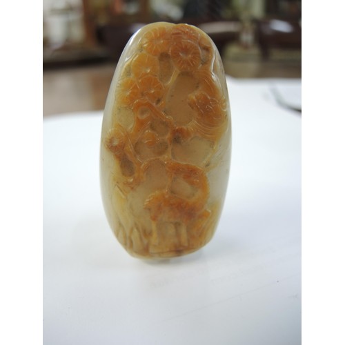 458 - Chinese white and russet jade snuff bottle, carved with a bird and a deer in landscapes, with a cora... 