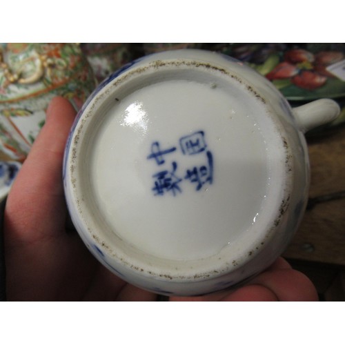 518 - Chinese blue and white teapot, decorated with figures and buildings in a landscape, having character... 