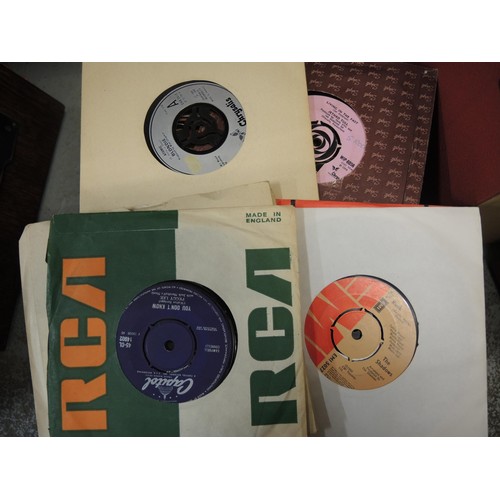 151 - Large collection in seven containers of various 45rpm records and a quantity of LP's