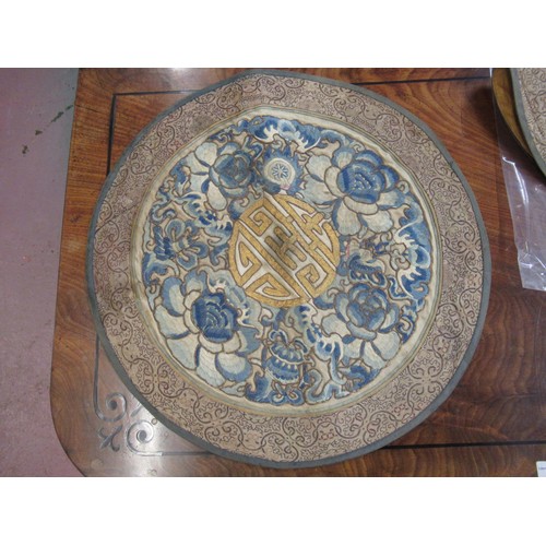 55 - Pair of Chinese circular silk embroidered panels with character mark to centres, 39.5 cm diameter