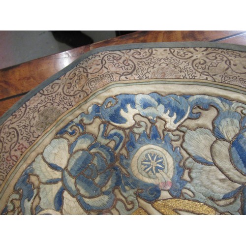 55 - Pair of Chinese circular silk embroidered panels with character mark to centres, 39.5 cm diameter