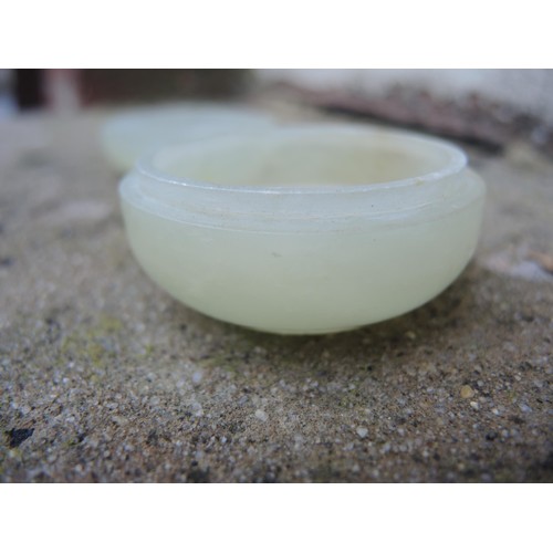 465 - Small circular pale green jade box and cover, 52mm diameter