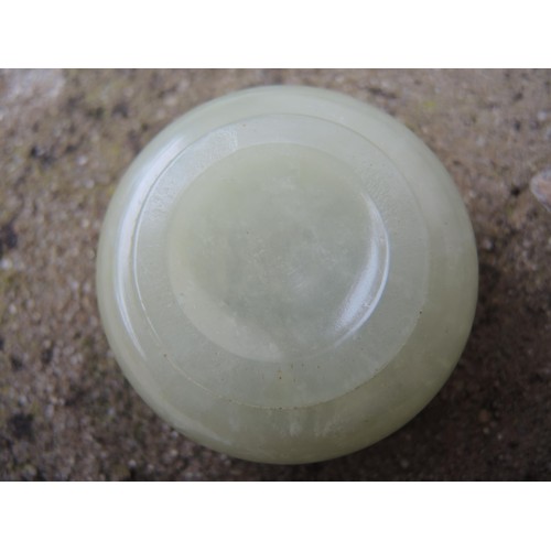 465 - Small circular pale green jade box and cover, 52mm diameter