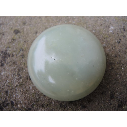 465 - Small circular pale green jade box and cover, 52mm diameter