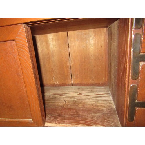 1962 - Japanese elm side cabinet, having iron mounts and handles, with arrangement of various drawers and s... 