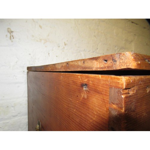 1971 - Stripped polished pine trunk, the hinged cover enclosing a candle box, raised on casters, 90cm wide ... 