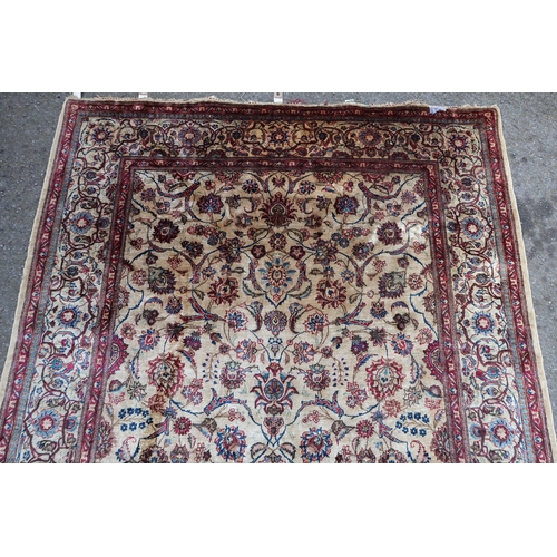 10 - Antique silk rug with all-over stylised floral design on an ivory ground with borders, possibly Isfa... 