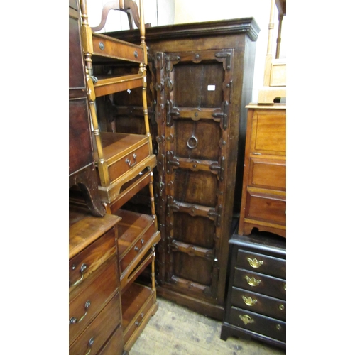 1600 - Indian hardwood two door cupboard incorporating a pair of antique iron studded doors enclosing a she... 