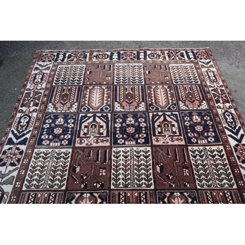 17 - Modern Bakhtiari carpet of repeating panel design with borders, 306 x 196cm