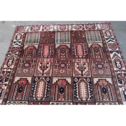 17 - Modern Bakhtiari carpet of repeating panel design with borders, 306 x 196cm