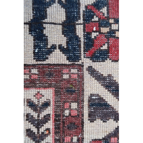 17 - Modern Bakhtiari carpet of repeating panel design with borders, 306 x 196cm