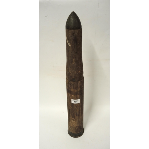 176 - First World War wooden training shell, together with an African carved hardwood wall mask