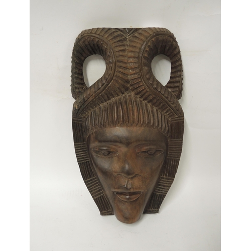 176 - First World War wooden training shell, together with an African carved hardwood wall mask