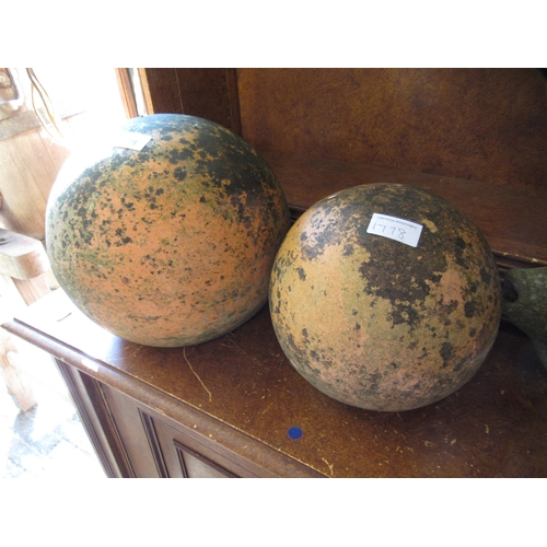 1778 - Two garden terra cotta globes, together with four pottery garden fish figures