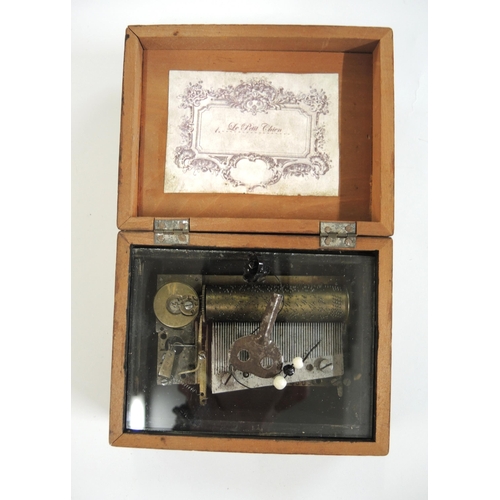 195 - Small musical box, the cover inset with a print of a pug dog