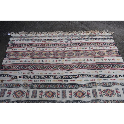 22 - Soumak carpet with banded design on an ivory ground, 293 x 190cm