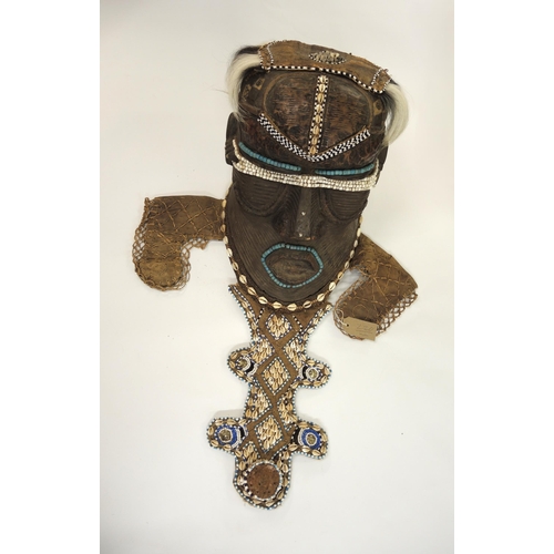 220 - Large African Pakuba bwoom mask mounted with various beads and shells, overall height 78cm