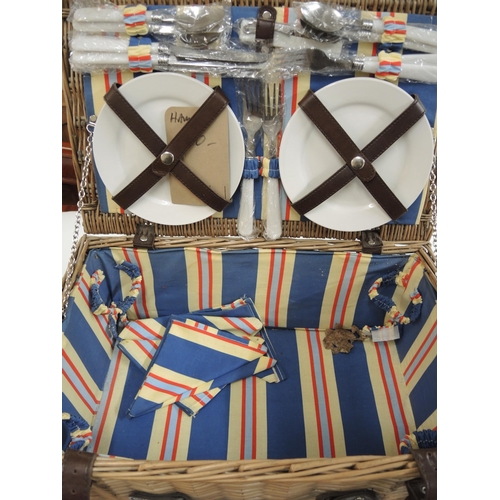 227 - Wicker picnic hamper, another similar and a quantity of various modern dolls