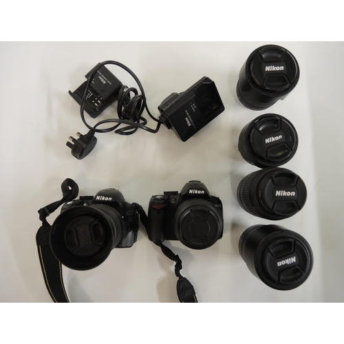 267 - Two Nikon SLR electronic cameras, models D3000 and D3200 together with a quantity of various Nikon l... 