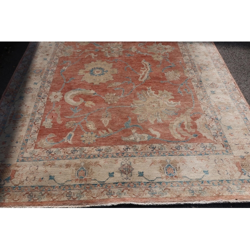 28 - Good quality Indo-Persian carpet of Ziegler design, with stylised palmettes on a brick red ground wi... 