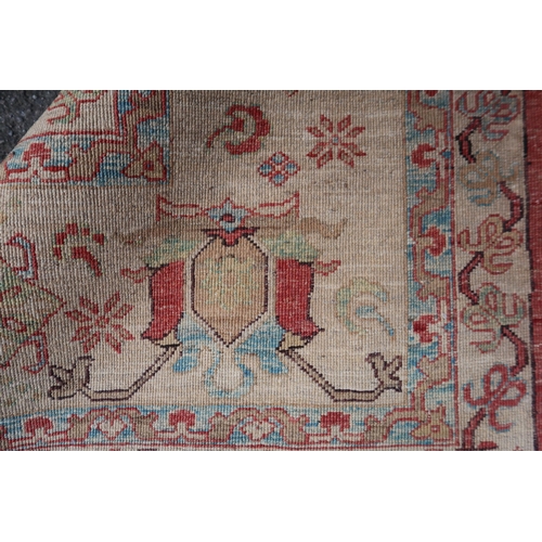 28 - Good quality Indo-Persian carpet of Ziegler design, with stylised palmettes on a brick red ground wi... 