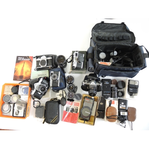 299 - Three Asahi Pentax cameras, two Olympus 35mm cameras and a quantity of various lenses and miscellane... 