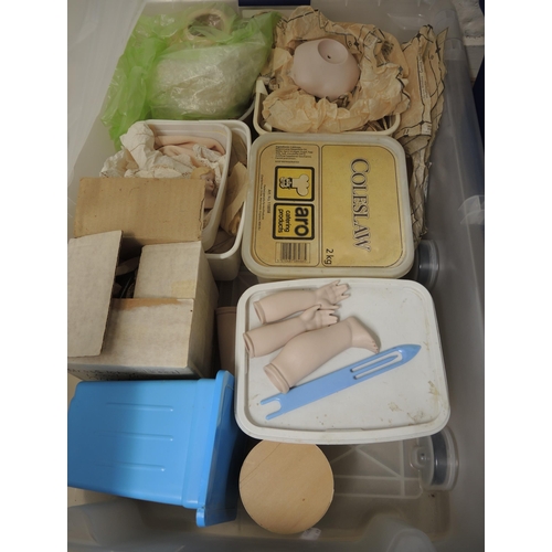 314 - Four boxes containing a large collection of dolls and doll making accessories including heads, limbs... 