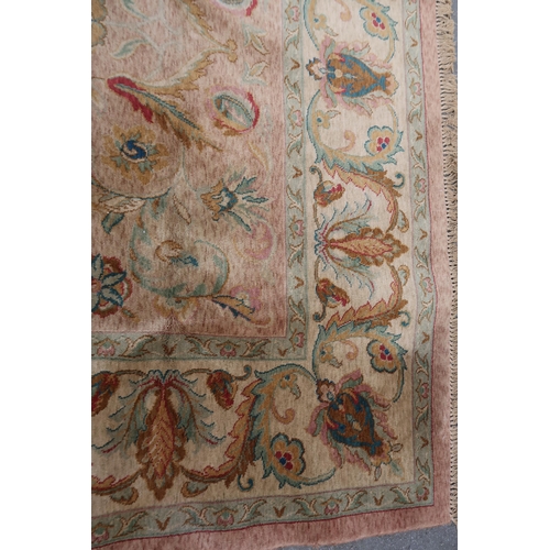 4 - Machine woven Agra style carpet, the all-over floral design on a beige ground, 340 x 240cm