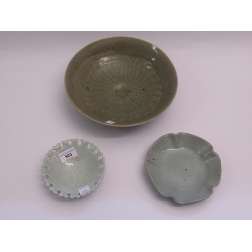 503 - Group of three green studio pottery bowls, each signed with seal mark to base, the largest 26cm diam... 