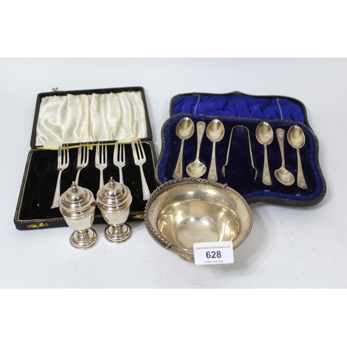 628 - Modern silver bonbon dish with swing handle, cased set of six silver teaspoons with tongs, five silv... 