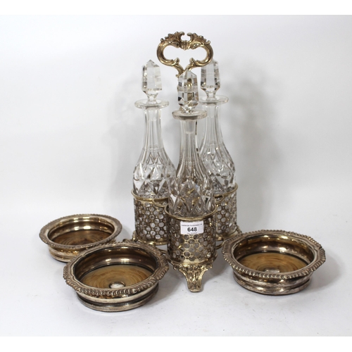 648 - Silver plated decanter stand with three cut glass decanters (one at fault), together with a pair of ... 