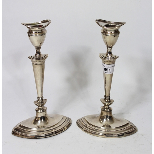 651 - Pair of early 20th Century oval silver candlesticks, 24cm high, London 1913, maker Thomas Bradbury a... 