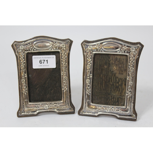 671 - Pair of small Birmingham silver mounted photograph frames, 13 x 10cm