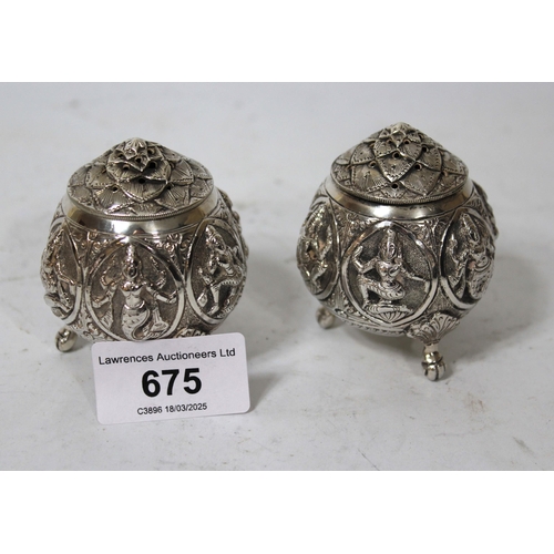 675 - Pair of Burmese white metal condiments cast with various figures, 3.8oz t