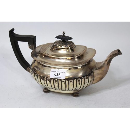 686 - Sheffield silver teapot of half fluted design with ebony handle by Walker and Hall, 23oz t