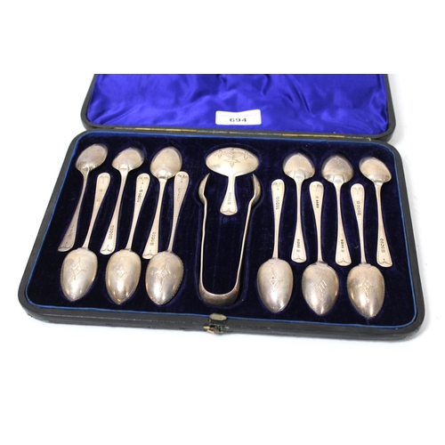 694 - Cased set of twelve silver teaspoons with matching tongs and caddy spoon, 6.5oz t