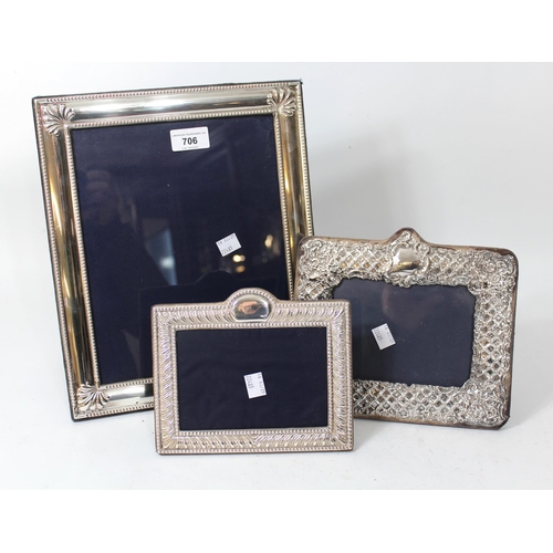 706 - Large silver rectangular photograph frame, 32 x 27cm, together with two smaller silver rectangular p... 