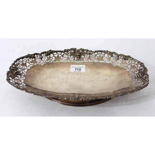 713 - 20th Century oval Sheffield silver pedestal bowl with pierced grape vine decoration 20oz t