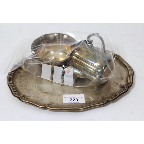 723 - Continental silver (835 mark) platter, cream jug and sugar bowl, and a Birmingham silver napkin ring... 