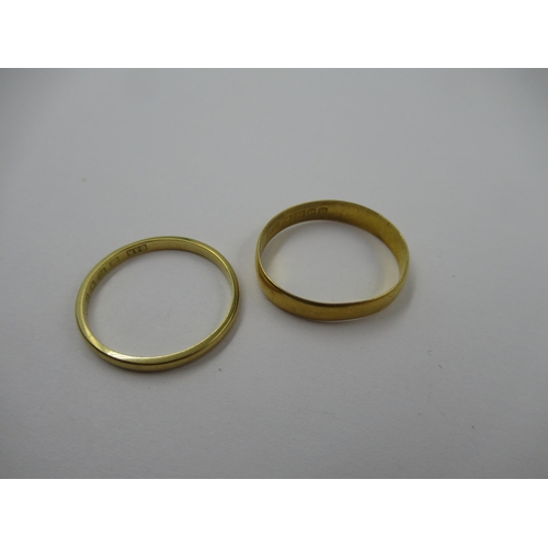 738 - 22ct Yellow gold wedding band, and an 18ct gold wedding band