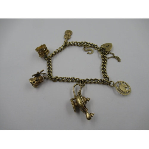 754 - 9ct Gold curb link charm bracelet with padlock clasp, 21g