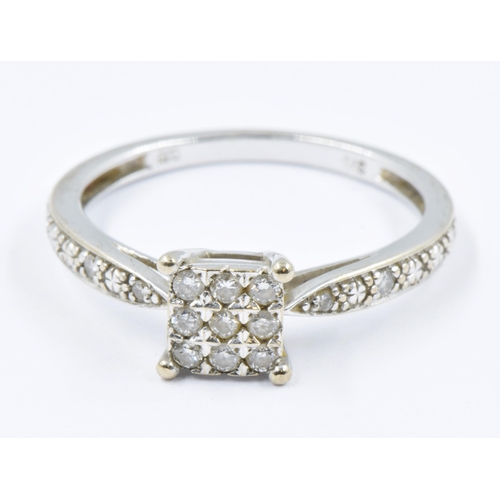 776 - 9ct White gold ring set diamonds in a square with diamond mounted shanks, 1.7g, size 'K'