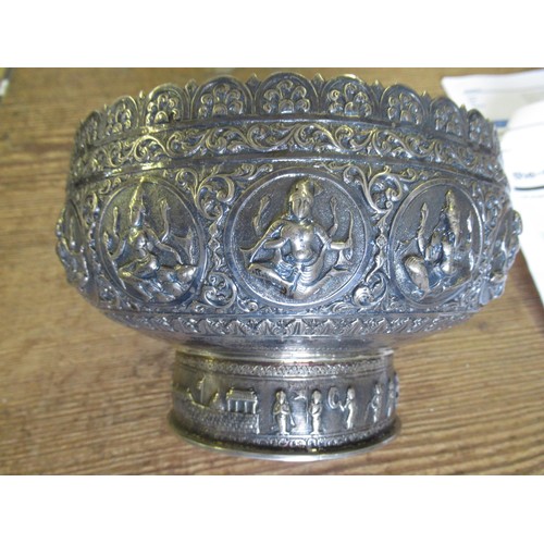 670 - Burmese white metal pedestal bowl cast with various figures, 20oz t