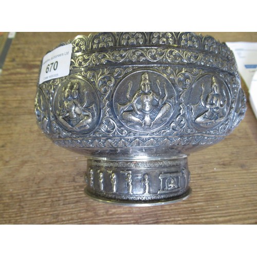 670 - Burmese white metal pedestal bowl cast with various figures, 20oz t