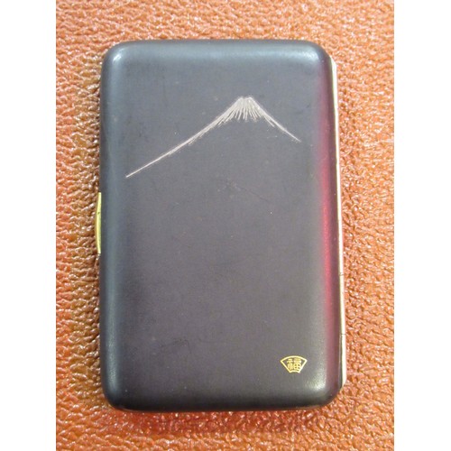 203 - Japanese rectangular black metal cigarette case, gold decorated with a tiger, signed to the reverse,... 