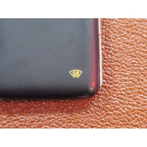 203 - Japanese rectangular black metal cigarette case, gold decorated with a tiger, signed to the reverse,... 