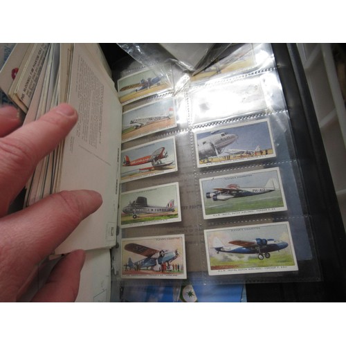 240 - Basket containing two trays of aviation related stickers, cards, badges and ephemera, together with ... 